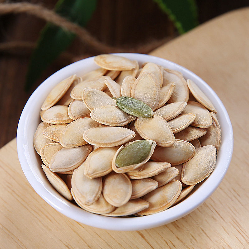 Where did the pumpkin seeds we eat first originate?